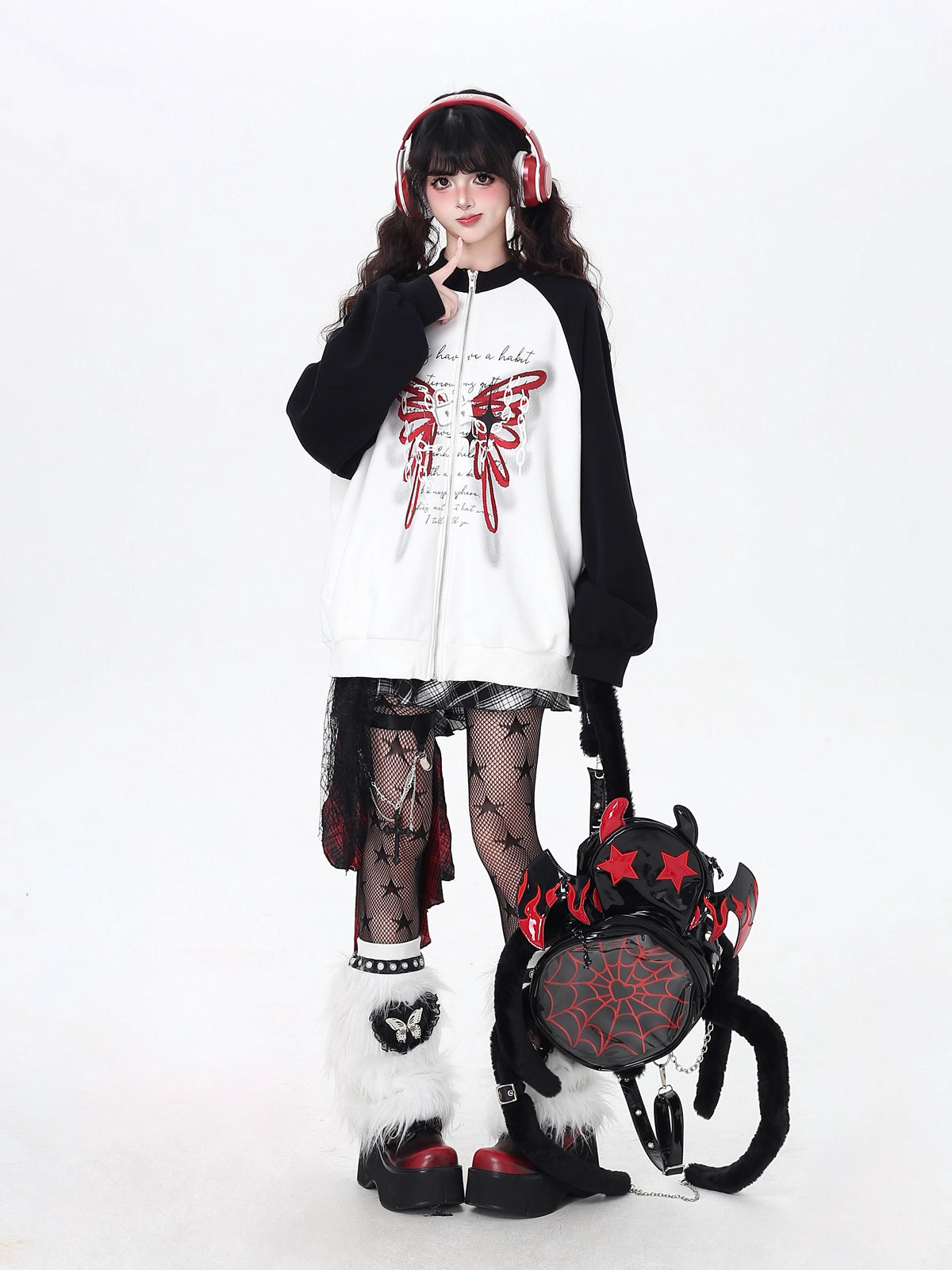 Edgy yet romantic, this coat features a bold high neckline and striking black-and-white color blocking. The oversized cut offers effortless cool, while subtle floral motifs hint at delicate rebellion. Perfect for layering in transitional weather, it embodies a blend of toughness and tenderness. For the dreamer with a rebellious heart.