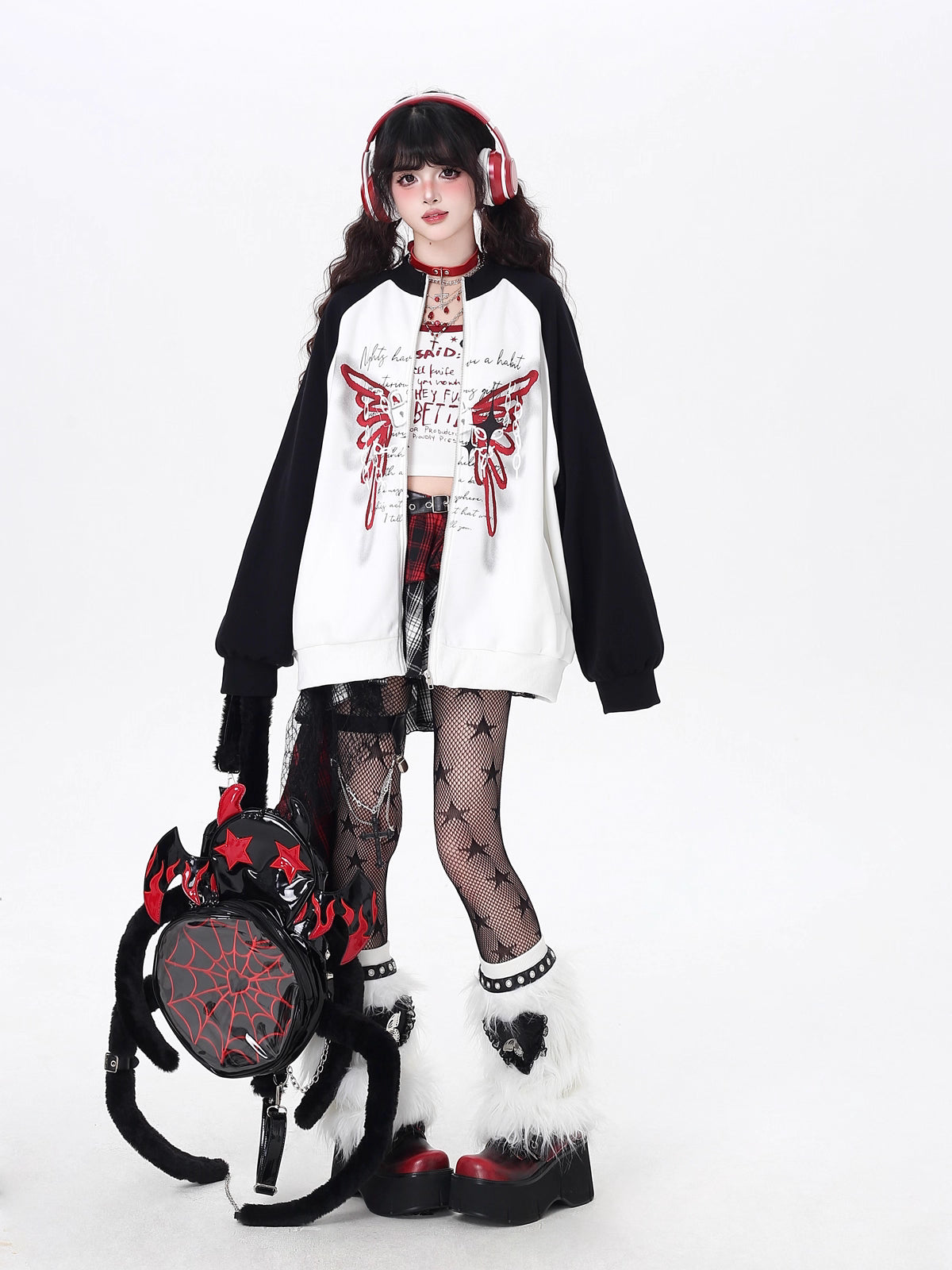 Edgy yet romantic, this coat features a bold high neckline and striking black-and-white color blocking. The oversized cut offers effortless cool, while subtle floral motifs hint at delicate rebellion. Perfect for layering in transitional weather, it embodies a blend of toughness and tenderness. For the dreamer with a rebellious heart.