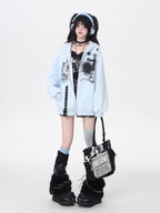 A soft take on dark aesthetics, this hoodie blends subtle gothic charm with effortless streetwear style. Delicate lace-like detailing and a versatile zip-front design create a layered look, while the relaxed fit and muted blue/beige tones keep it wearable and fresh. Lightweight for early autumn, it layers seamlessly over bras, tanks, or dresses—for those who express their edge with subtlety and grace.