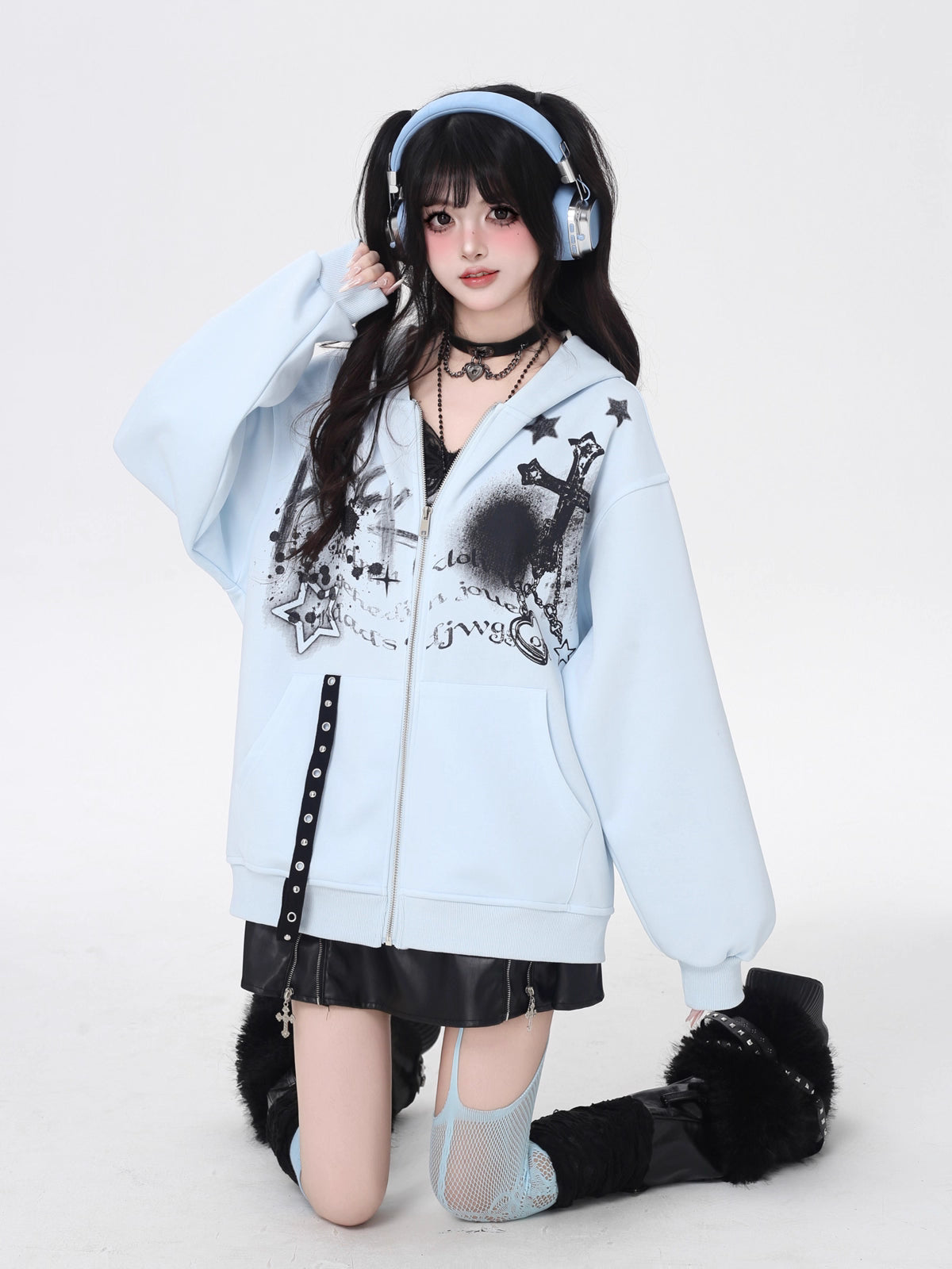 A soft take on dark aesthetics, this hoodie blends subtle gothic charm with effortless streetwear style. Delicate lace-like detailing and a versatile zip-front design create a layered look, while the relaxed fit and muted blue/beige tones keep it wearable and fresh. Lightweight for early autumn, it layers seamlessly over bras, tanks, or dresses—for those who express their edge with subtlety and grace.