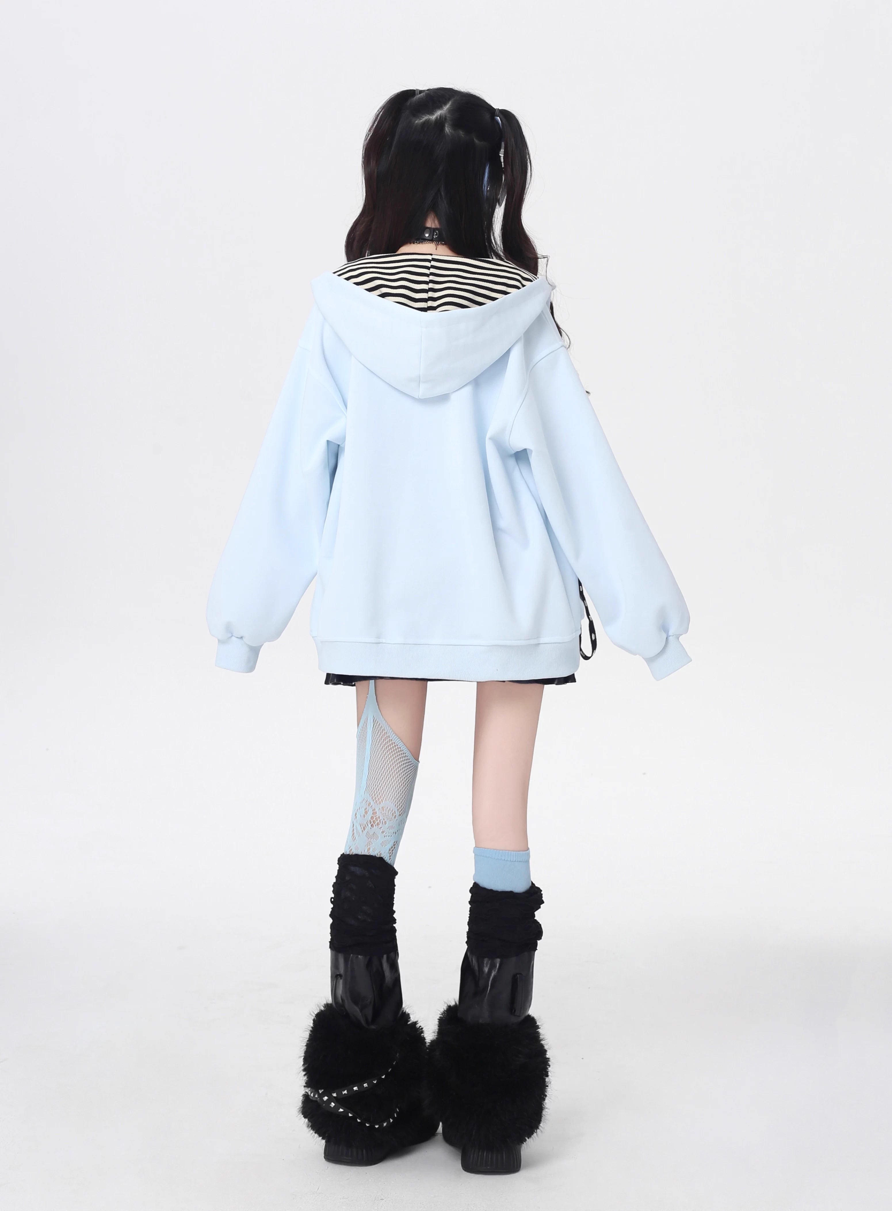 A soft take on dark aesthetics, this hoodie blends subtle gothic charm with effortless streetwear style. Delicate lace-like detailing and a versatile zip-front design create a layered look, while the relaxed fit and muted blue/beige tones keep it wearable and fresh. Lightweight for early autumn, it layers seamlessly over bras, tanks, or dresses—for those who express their edge with subtlety and grace.
