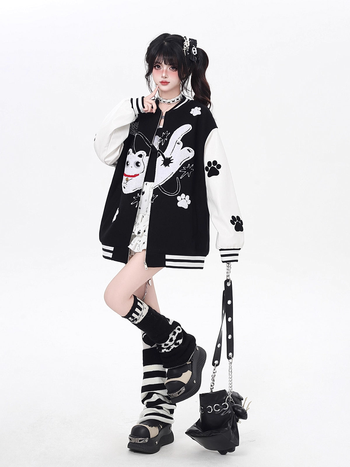 Inspired by cosmic curiosity and urban style, this baseball jacket combines celestial cat embroidery with bold color-blocking. The relaxed fit and soft fabric offer comfort with a rebellious edge, perfect for day-to-night versatility. A statement piece for those who love playful yet cool aesthetics.
