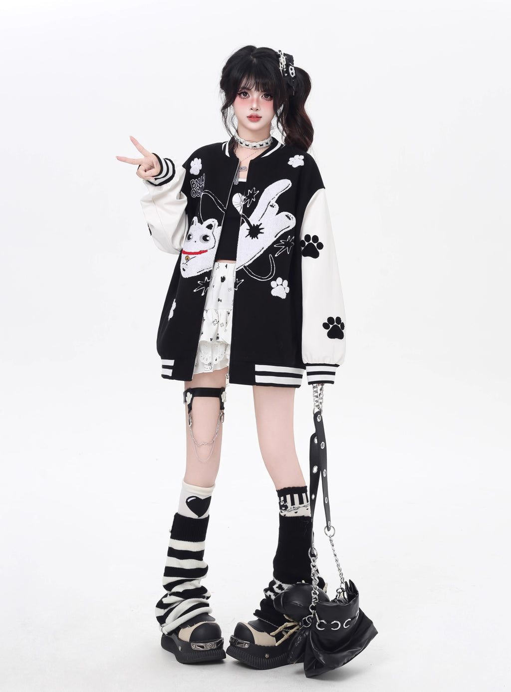 Inspired by cosmic curiosity and urban style, this baseball jacket combines celestial cat embroidery with bold color-blocking. The relaxed fit and soft fabric offer comfort with a rebellious edge, perfect for day-to-night versatility. A statement piece for those who love playful yet cool aesthetics.