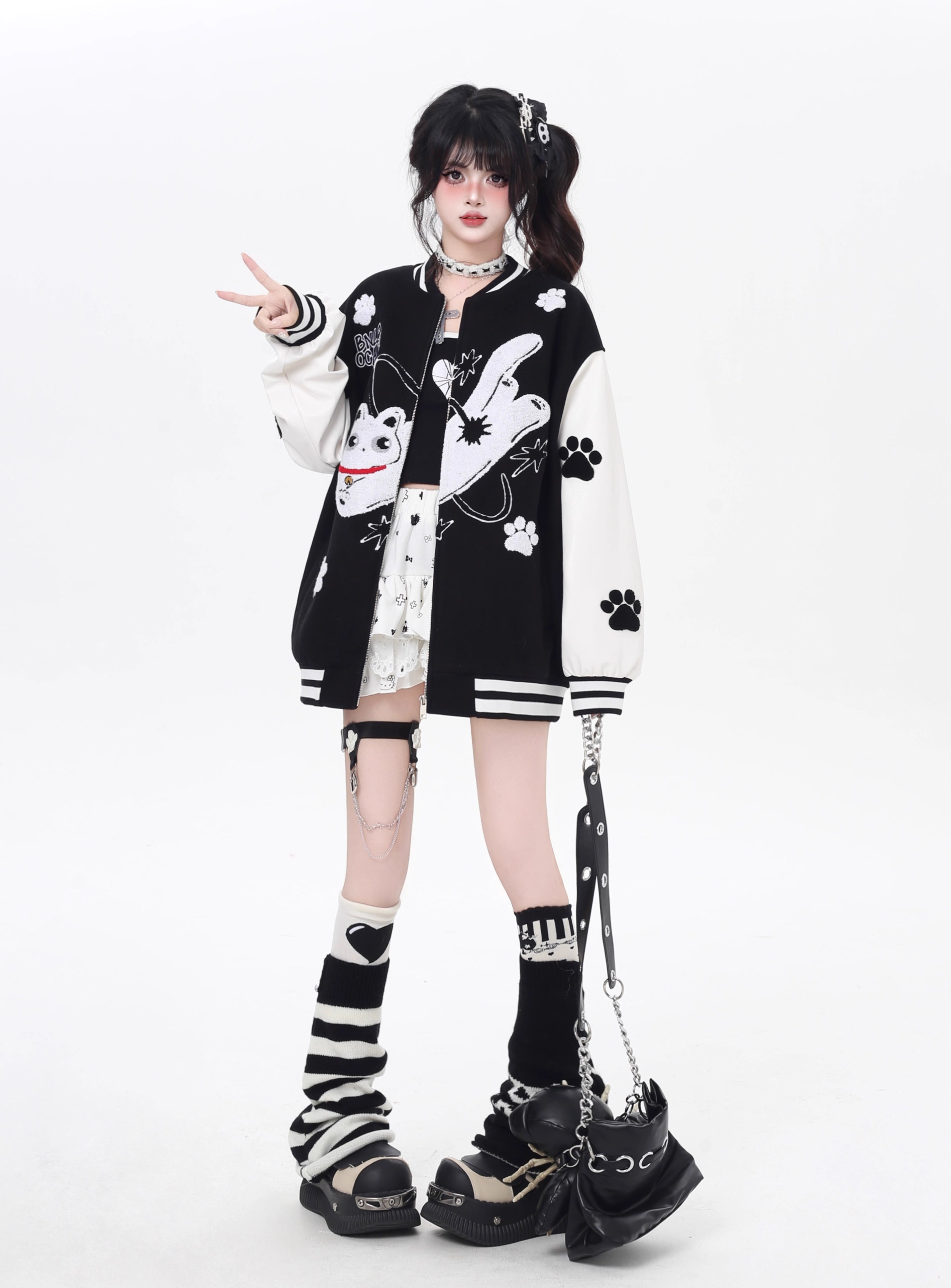Inspired by cosmic curiosity and urban style, this baseball jacket combines celestial cat embroidery with bold color-blocking. The relaxed fit and soft fabric offer comfort with a rebellious edge, perfect for day-to-night versatility. A statement piece for those who love playful yet cool aesthetics.