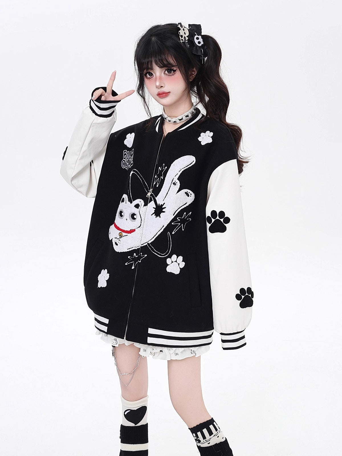 Inspired by cosmic curiosity and urban style, this baseball jacket combines celestial cat embroidery with bold color-blocking. The relaxed fit and soft fabric offer comfort with a rebellious edge, perfect for day-to-night versatility. A statement piece for those who love playful yet cool aesthetics.