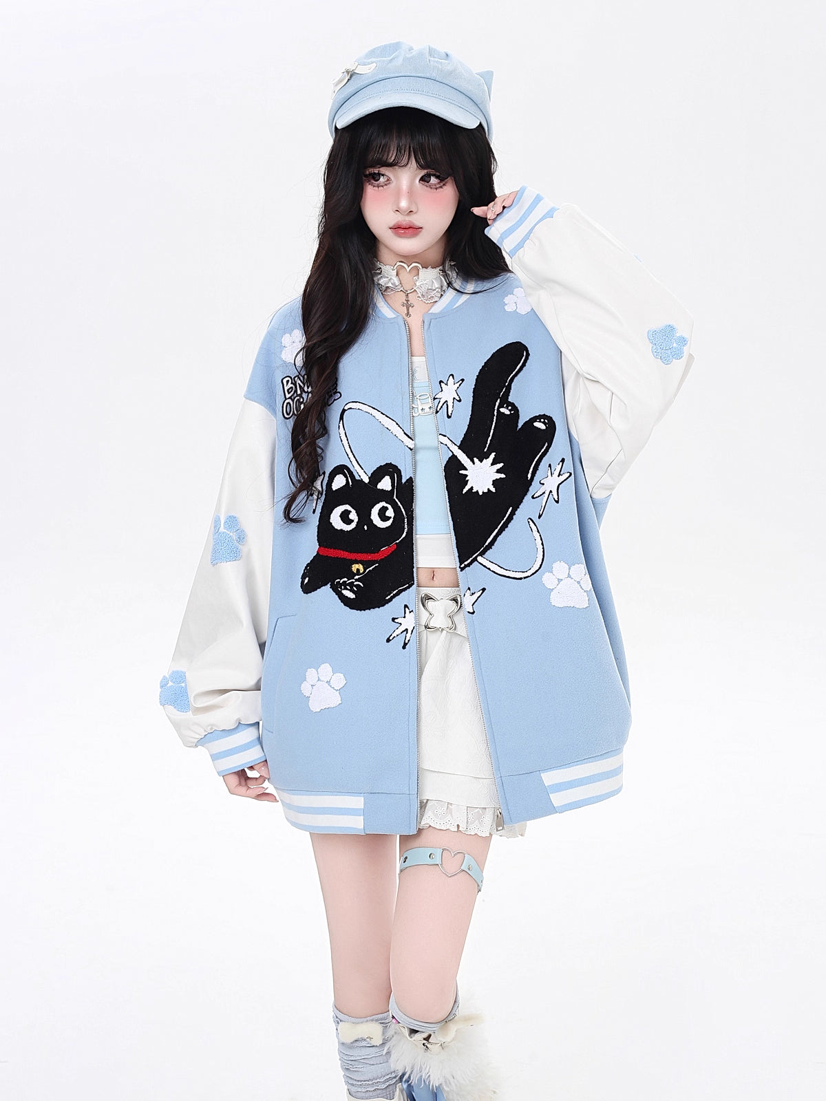 Inspired by cosmic curiosity and urban style, this baseball jacket combines celestial cat embroidery with bold color-blocking. The relaxed fit and soft fabric offer comfort with a rebellious edge, perfect for day-to-night versatility. A statement piece for those who love playful yet cool aesthetics.