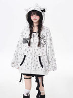 A light grey open-front cardigan blending subtle sweetness with streetwise softness. Delicate cross-stitch embroidery and a small kitten motif create a quiet yet charming statement, while the relaxed hooded design offers effortless layering potential. Perfect for early autumn's in-between weather—soft, lightweight, and subtly expressive.