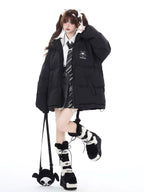 This bold winter jacket blends playful sweetness with rebellious edge. Featuring a striking 3D devil motif and plush oversized silhouette, it delivers both warmth and attitude. The deep hood, soft padding, and included devil-themed crossbody bag create a cohesive, street-ready look. Perfect for expressing your unique mix of cute and cool during the cold season.