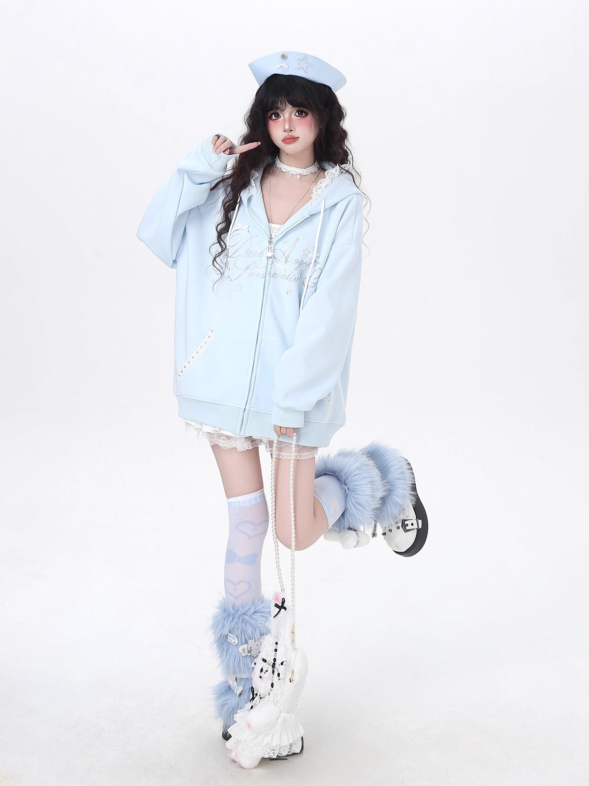 Blending streetwear ease with delicate charm, this hoodie features soft lace accents and a relaxed oversized fit. The playful pink, black, and blue color-blocking adds youthful energy, while the cozy fabric ensures comfort. Perfect for layering, it subtly merges softness with urban casual style.