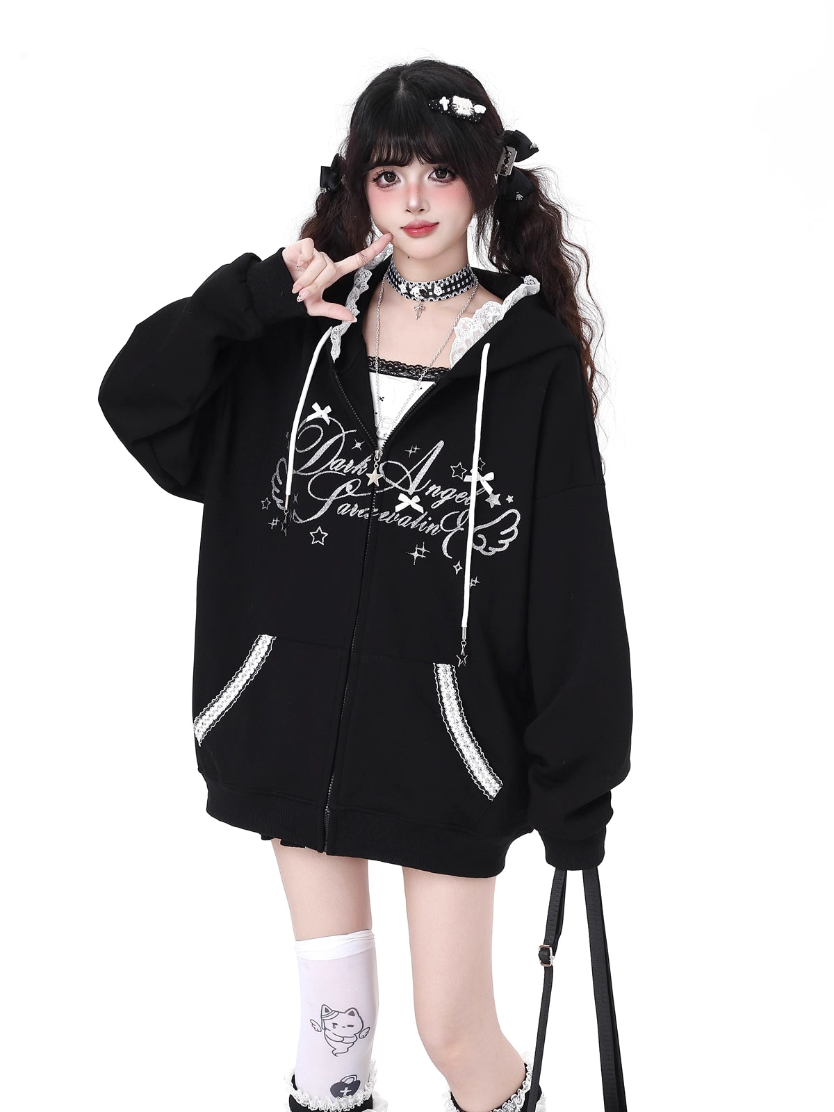 Blending streetwear ease with delicate charm, this hoodie features soft lace accents and a relaxed oversized fit. The playful pink, black, and blue color-blocking adds youthful energy, while the cozy fabric ensures comfort. Perfect for layering, it subtly merges softness with urban casual style.