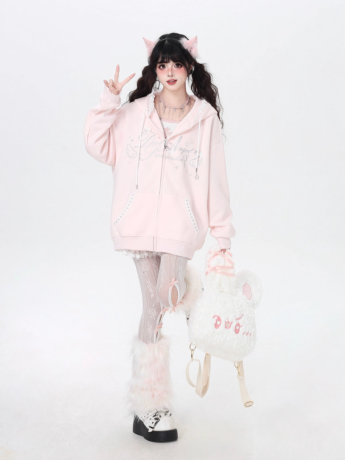 Blending streetwear ease with delicate charm, this hoodie features soft lace accents and a relaxed oversized fit. The playful pink, black, and blue color-blocking adds youthful energy, while the cozy fabric ensures comfort. Perfect for layering, it subtly merges softness with urban casual style.