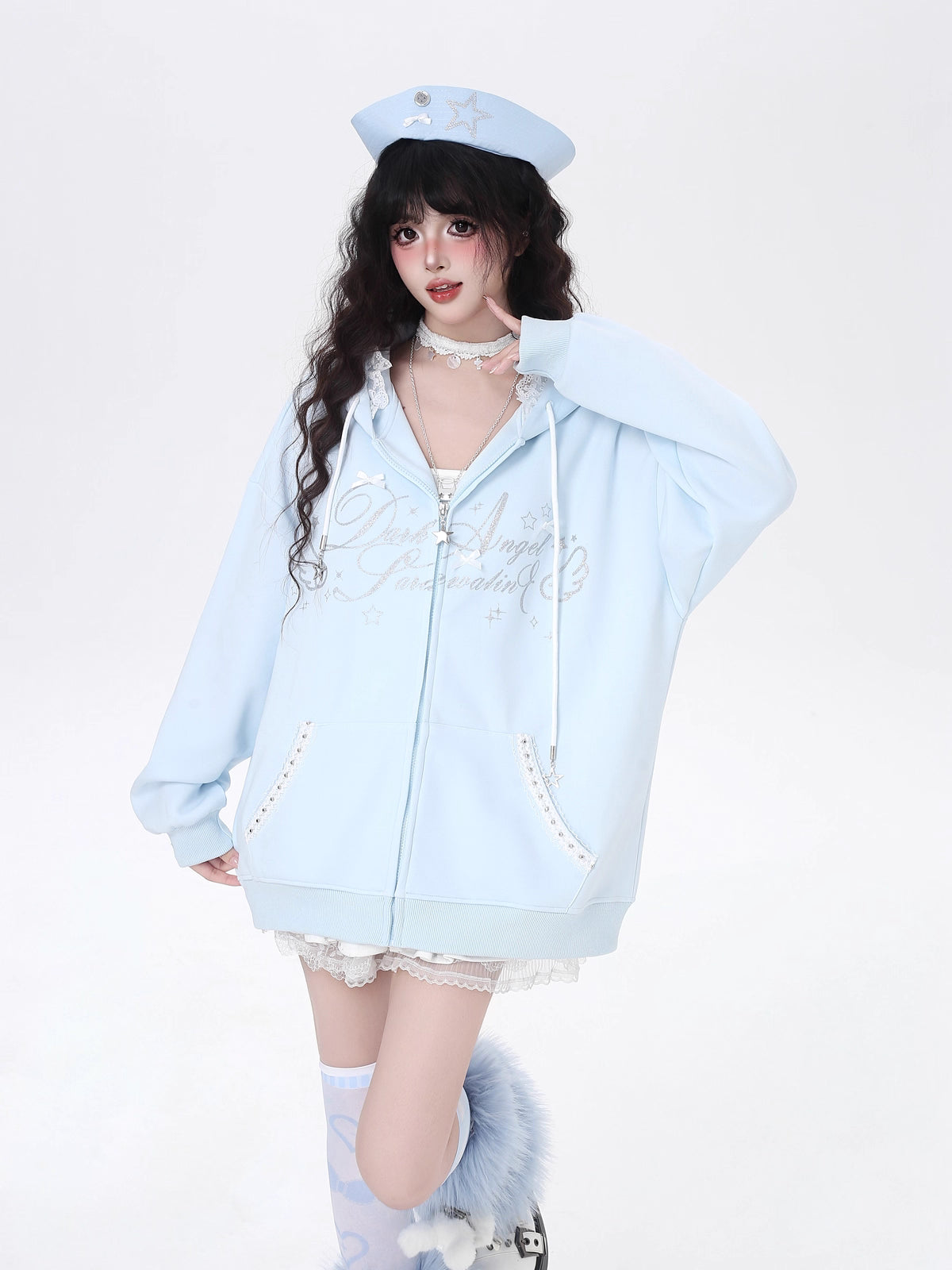 Blending streetwear ease with delicate charm, this hoodie features soft lace accents and a relaxed oversized fit. The playful pink, black, and blue color-blocking adds youthful energy, while the cozy fabric ensures comfort. Perfect for layering, it subtly merges softness with urban casual style.