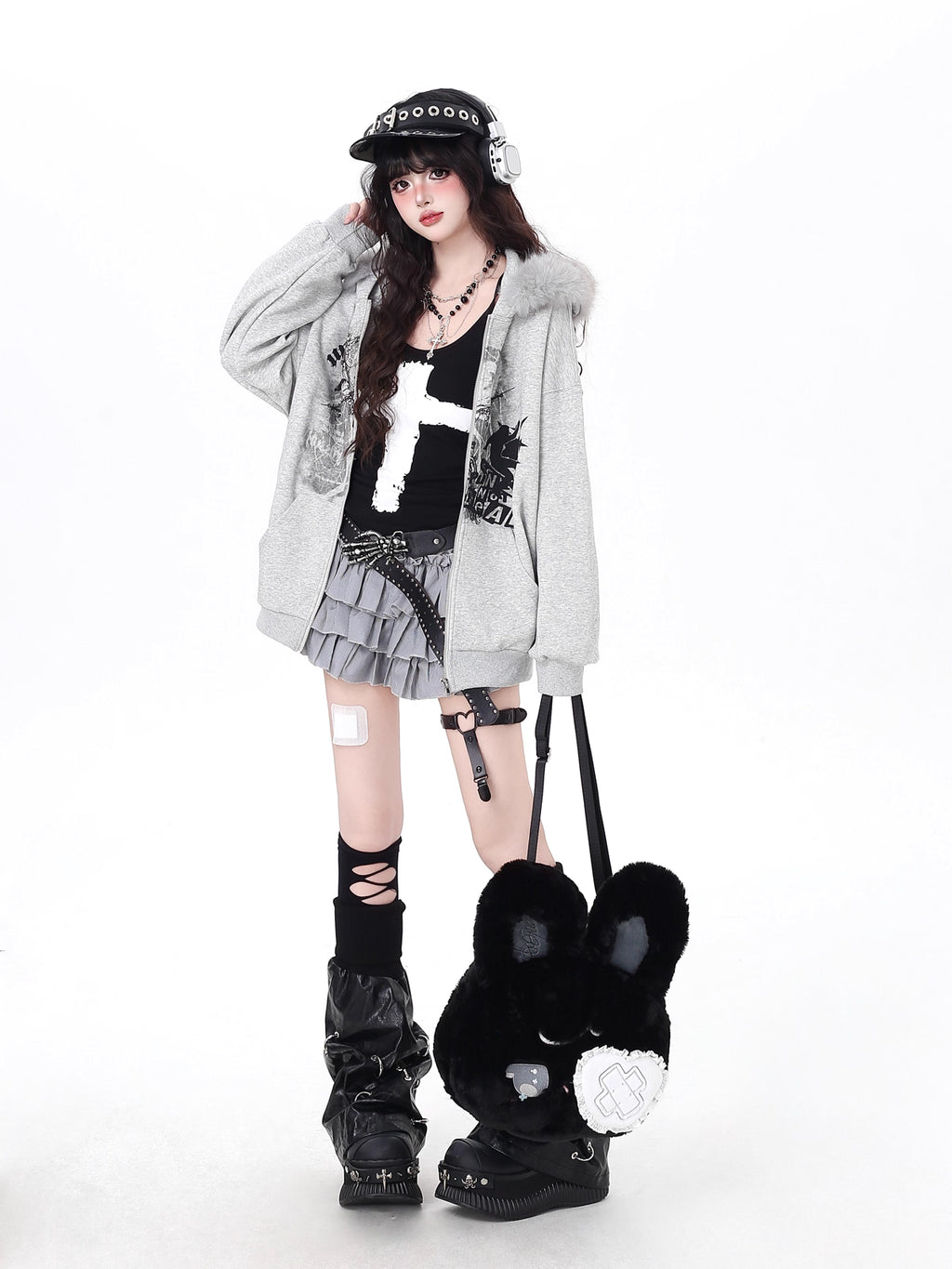 Mixing retro aesthetics with modern functionality, this hoodie features a removable faux fur-lined hood for versatile styling. The oversized cut and neutral grey-white palette offer effortless urban vibes, while brushed fleece interior ensures cozy warmth. Ideal for expressing low-key, laid-back street style with a nostalgic twist.