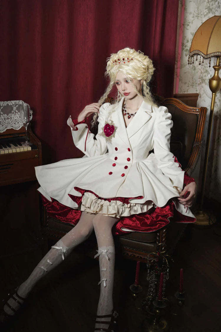 This coat defies convention with its dramatic asymmetrical hemline, blending Gothic mystery and Lolita elegance. The stark white hue and sharp double-breasted structure create a striking visual tension, while the elongated back silhouette adds a touch of theatrical romance. Designed for those who dare to stand out, it transforms the wearer into a vision of haunting beauty—where darkness and light intertwine in poetic contrast.