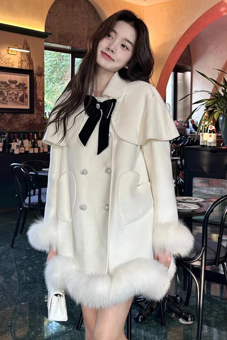 Blending whimsy with elegance, this cape coat transforms classic Lolita charm into a versatile outerwear piece. The playful rabbit ears and delicate bow contrast the monochrome palette, creating a striking balance between sweetness and sophistication. Designed with a flowing silhouette and single-row button closure, it offers effortless layering for cool days—perfect for adding a touch of fantasy to both casual and formal Lolita coordinates.