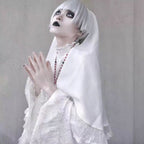This striking headwear merges ecclesiastical elegance with punk rebellion. The adjustable elastic band ensures comfort, while the stark black-and-white veil creates dramatic draping. Perfect for adding sacred-edgy contrast to Gothic Lolita coordinations or avant-garde fashion statements. Its minimalist design embodies dark sophistication with a rebellious spirit.