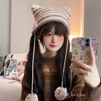 Crafted for the playful rebel, this beanie blends Y2K nostalgia with whimsical Lolita charm. The mischievous cat ears and devilish pointed silhouette are softened by a fluffy pom-pom, creating a bold yet adorable statement. Knitted from soft, stretchable yarn with vibrant stripes, it offers cozy comfort and a touch of fantasy, empowering you to express your unique blend of sweetness and rebellion in every season.