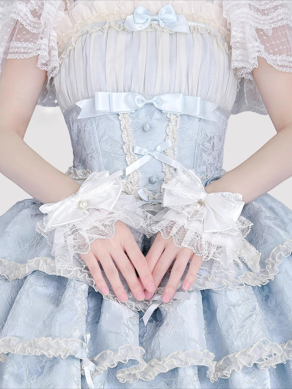 Design Concept:
Inspired by the delicate elegance of Lolita fashion, these wrist cuffs blend fantasy and femininity. Adorned with intricate lace, dainty pearls, and a charming bow accent, they embody romantic innocence. Crafted from soft materials for all-day comfort, they offer a subtle yet enchanting touch to JK uniforms or Lolita coordinates, perfect for expressing timeless sweetness and grace.