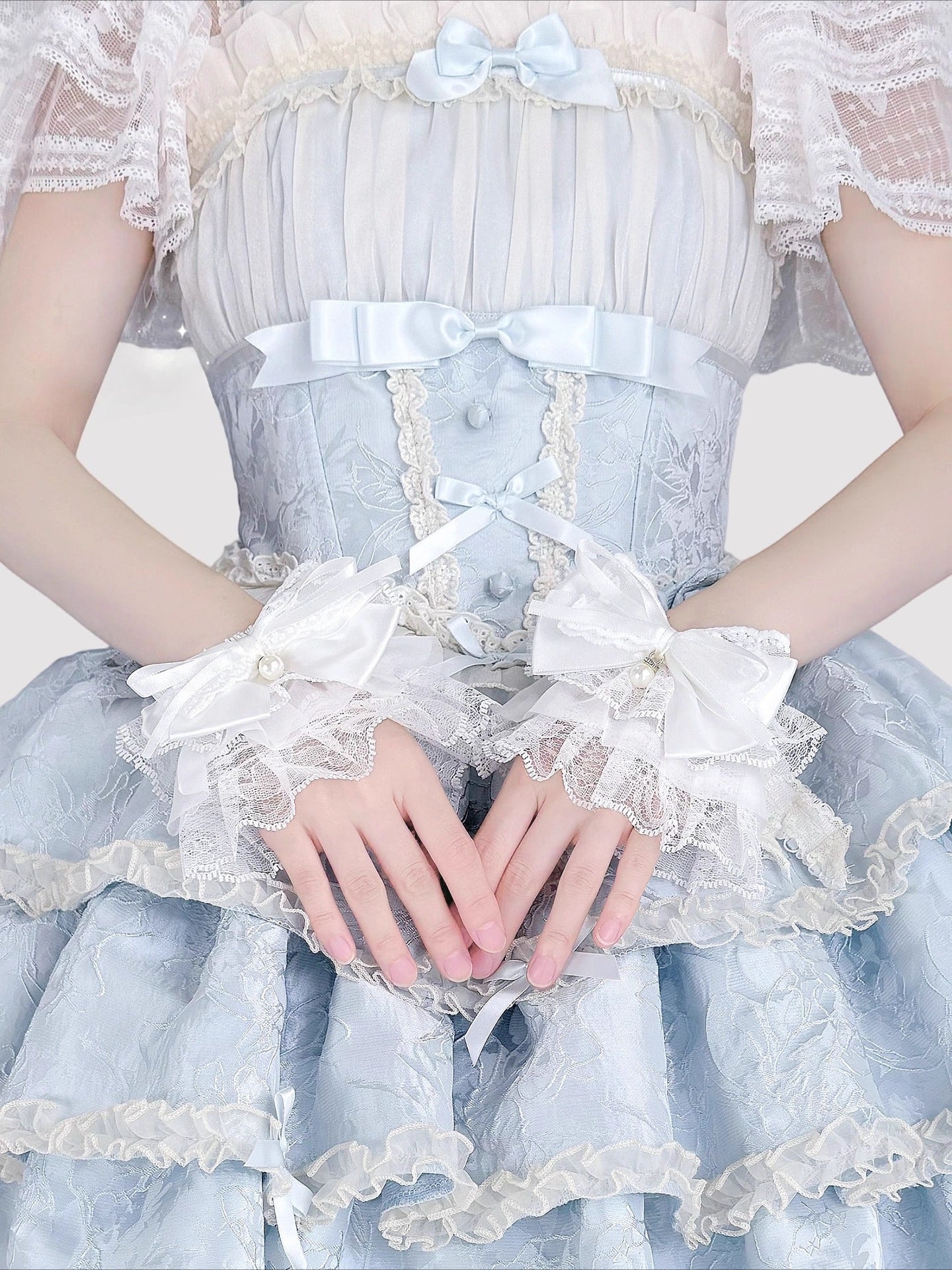 Design Concept:
Inspired by the delicate elegance of Lolita fashion, these wrist cuffs blend fantasy and femininity. Adorned with intricate lace, dainty pearls, and a charming bow accent, they embody romantic innocence. Crafted from soft materials for all-day comfort, they offer a subtle yet enchanting touch to JK uniforms or Lolita coordinates, perfect for expressing timeless sweetness and grace.