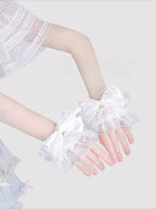 Inspired by the delicate elegance of Lolita fashion, these wrist cuffs blend fantasy and femininity. Adorned with intricate lace, dainty pearls, and a charming bow accent, they embody romantic innocence. Crafted from soft materials for all-day comfort, they offer a subtle yet enchanting touch to JK uniforms or Lolita coordinates, perfect for expressing timeless sweetness and grace.