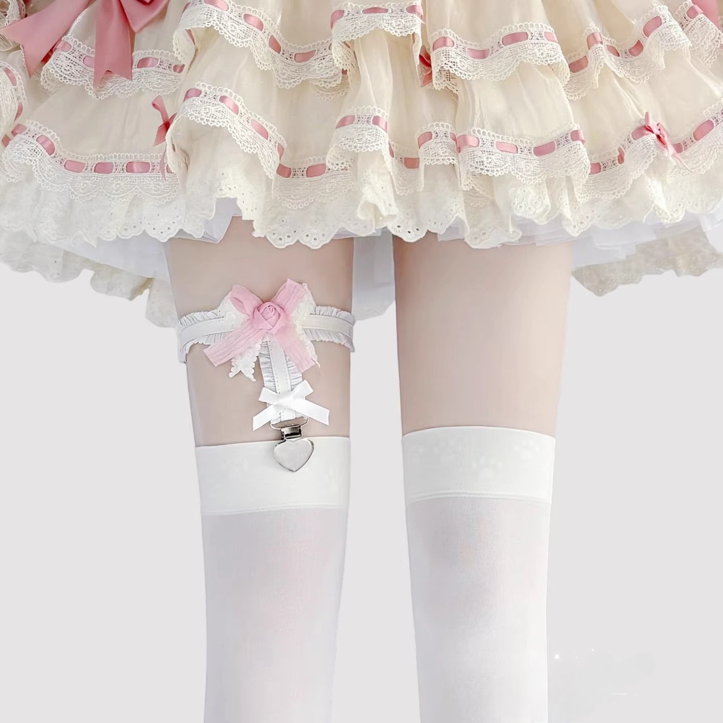 Inspired by the delicate details of Lolita fashion, this garter combines fantasy and function. Soft elastic fabric adorned with intricate lace, a dainty rose, and a satin bow creates a romantic yet playful accessory. The adjustable design and anti-slip grip ensure comfort and security, perfect for adding a touch of whimsical elegance to Lolita coordinates, cosplay outfits, or vintage-inspired ensembles.