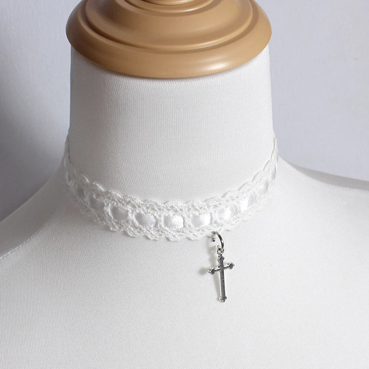 This Cross Lace Choker Necklace blends Gothic elegance with Lolita sweetness. Decorated with delicate lace and a central cross pendant, it exudes both mystery and charm. Available in white, blue, black, and pink, it adapts to different moods and outfits. Perfect for Gothic, Lolita, or vintage-inspired styles, this versatile accessory adds a graceful yet bold touch to any look, making it ideal for parties, cosplay, or daily wear.