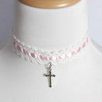 This Cross Lace Choker Necklace blends Gothic elegance with Lolita sweetness. Decorated with delicate lace and a central cross pendant, it exudes both mystery and charm. Available in white, blue, black, and pink, it adapts to different moods and outfits. Perfect for Gothic, Lolita, or vintage-inspired styles, this versatile accessory adds a graceful yet bold touch to any look, making it ideal for parties, cosplay, or daily wear.