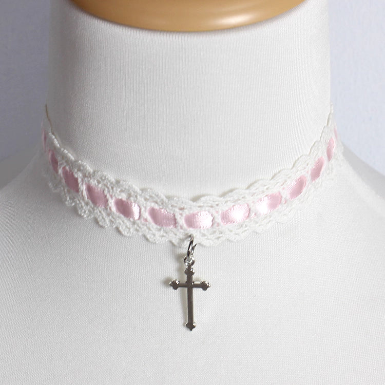 This Cross Lace Choker Necklace blends Gothic elegance with Lolita sweetness. Decorated with delicate lace and a central cross pendant, it exudes both mystery and charm. Available in white, blue, black, and pink, it adapts to different moods and outfits. Perfect for Gothic, Lolita, or vintage-inspired styles, this versatile accessory adds a graceful yet bold touch to any look, making it ideal for parties, cosplay, or daily wear.