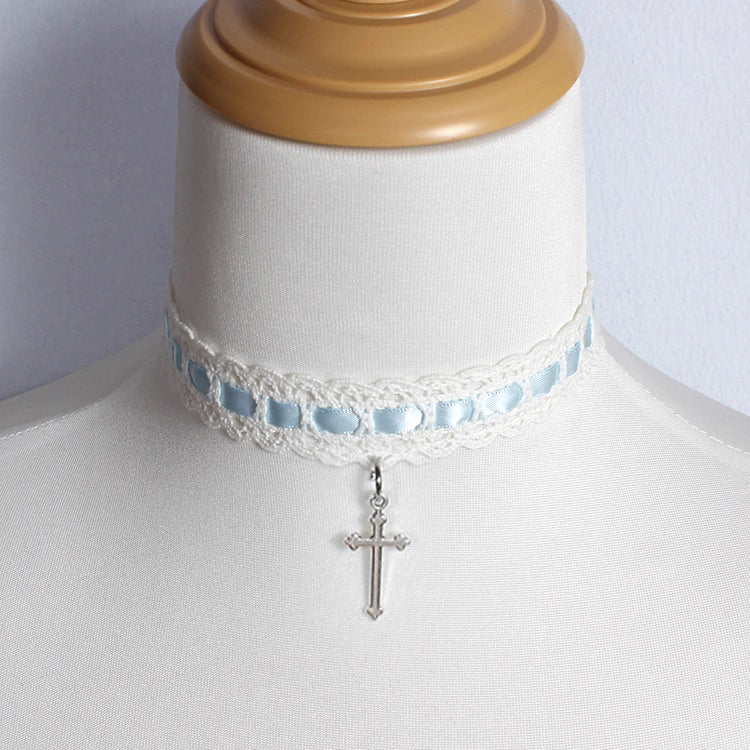 This Cross Lace Choker Necklace blends Gothic elegance with Lolita sweetness. Decorated with delicate lace and a central cross pendant, it exudes both mystery and charm. Available in white, blue, black, and pink, it adapts to different moods and outfits. Perfect for Gothic, Lolita, or vintage-inspired styles, this versatile accessory adds a graceful yet bold touch to any look, making it ideal for parties, cosplay, or daily wear.