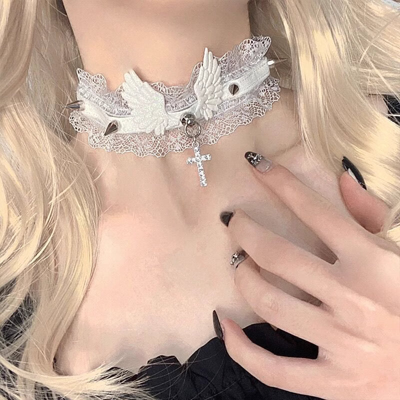This Lolita Cyberpunk Gothic Choker Necklace fuses edgy punk style with vintage Lolita elegance. Designed with delicate lace, bold studs, and angel wing accents, it creates a striking balance of softness and rebellion. Available in classic black and white, it is a versatile accessory to match both sweet and dark Lolita outfits. Perfect for parties, photoshoots, or themed events, this choker adds a unique cyber-gothic touch to any ensemble.