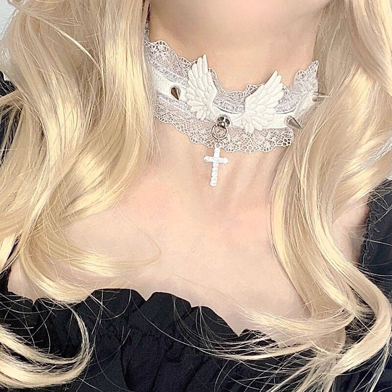 This Lolita Cyberpunk Gothic Choker Necklace fuses edgy punk style with vintage Lolita elegance. Designed with delicate lace, bold studs, and angel wing accents, it creates a striking balance of softness and rebellion. Available in classic black and white, it is a versatile accessory to match both sweet and dark Lolita outfits. Perfect for parties, photoshoots, or themed events, this choker adds a unique cyber-gothic touch to any ensemble.