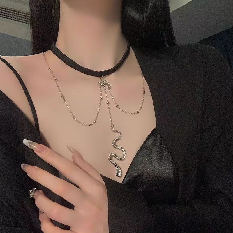 This Dark Lolita Cyberpunk Gothic Snake Necklace blends mysterious elegance with bold punk energy. The unique serpent design symbolizes strength and rebellion, while its sleek metallic finish adds a futuristic Y2K edge. Perfect for Gothic, punk, or alternative styles, it enhances any outfit with a touch of daring attitude. Ideal for parties, concerts, or daily wear for girls who love dark aesthetics and statement accessories.
