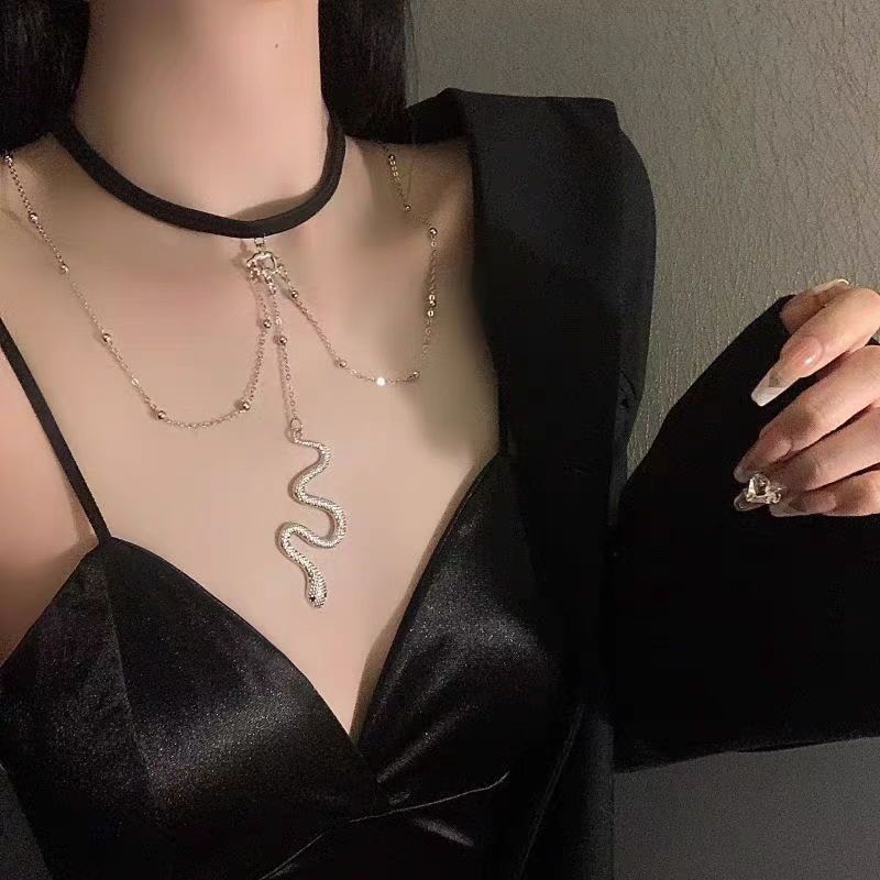 This Dark Lolita Cyberpunk Gothic Snake Necklace blends mysterious elegance with bold punk energy. The unique serpent design symbolizes strength and rebellion, while its sleek metallic finish adds a futuristic Y2K edge. Perfect for Gothic, punk, or alternative styles, it enhances any outfit with a touch of daring attitude. Ideal for parties, concerts, or daily wear for girls who love dark aesthetics and statement accessories.