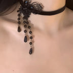 This Lolita Gothic Choker Necklace blends elegance with a dark romantic charm. Crafted from delicate black lace, it features a butterfly centerpiece adorned with pearls and flowing tassels, creating a graceful layered look. Designed to highlight the collarbone, it adds both mystery and sophistication to any outfit. Perfect for gothic Lolita ensembles, parties, or special occasions, this accessory is a refined statement piece that enhances the allure of classic dark Lolita style.