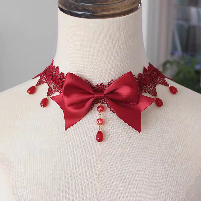This Lolita Lace Bowknot Pearl Choker Necklace is designed as a versatile accessory to elevate any Lolita look. Featuring delicate lace, dainty pearls, and a sweet bowknot centerpiece, it strikes a balance between elegance and cuteness. The soft yet ornate design makes it perfect for pairing with dresses, from sweet styles to gothic ensembles. Ideal for tea parties, photoshoots, or daily styling, this choker adds a refined touch of Lolita charm.