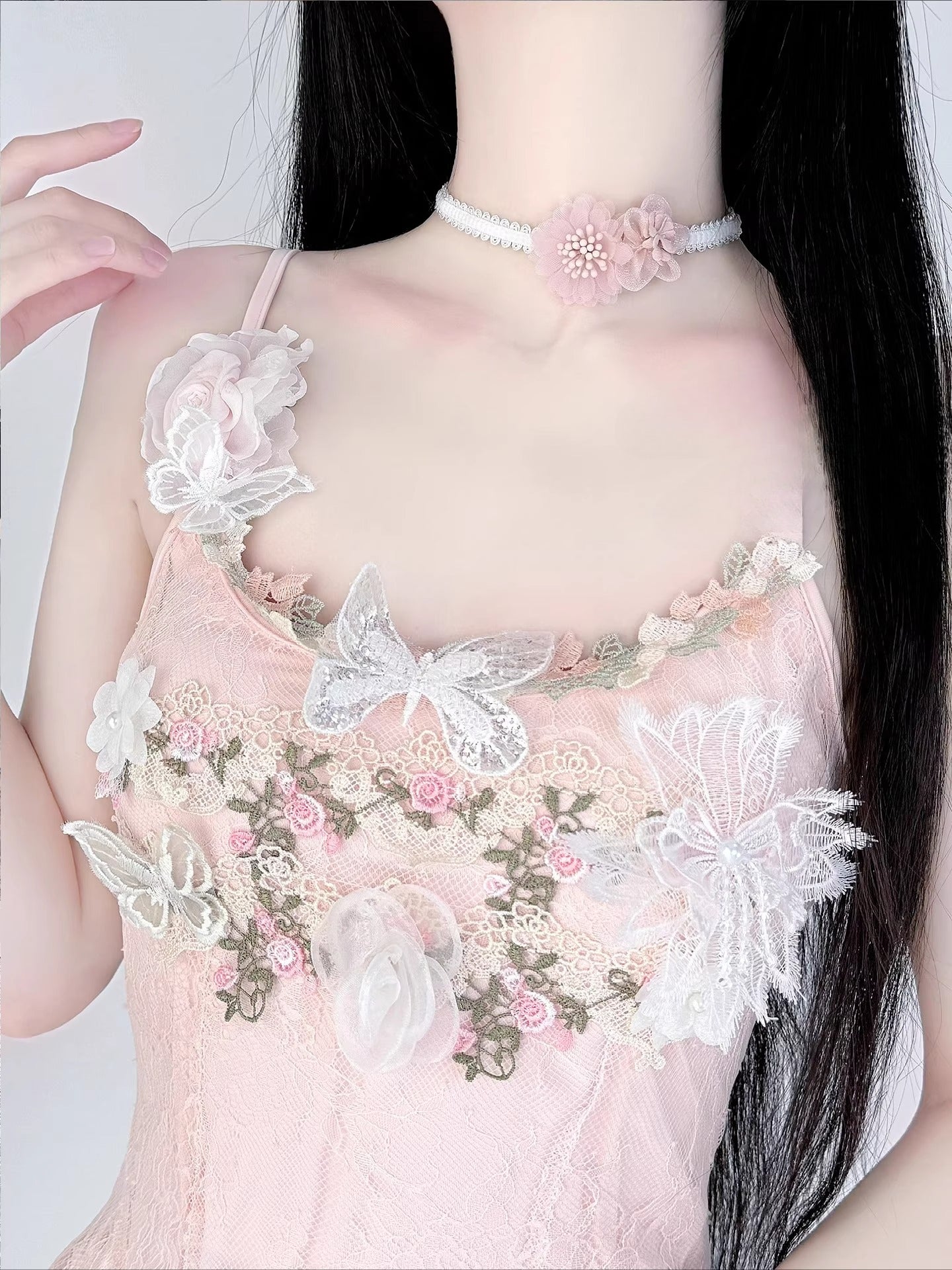 Inspired by the gentle romance of garden florals and Lolita aesthetics, this choker blooms with delicate charm. Featuring dainty pink daisies and a short, tailored fit, it rests perfectly on the collarbone for a touch of whimsical elegance. The playful yet refined design captures the essence of sweet Lolita fashion, making it an ideal accessory for adding a dreamy, feminine accent to any coordinate.
