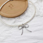 This Silver Bow Pearl Necklace combines the sweetness of pearls with the elegance of a delicate bow, creating a perfect balance of charm and style. Its silver-toned finish adds a modern touch, while the Lolita-inspired design makes it both cute and versatile. Ideal for sweet Lolita, casual chic, or cool girl aesthetics, this necklace is a must-have accessory that elevates outfits for parties, gatherings, or everyday fashion.