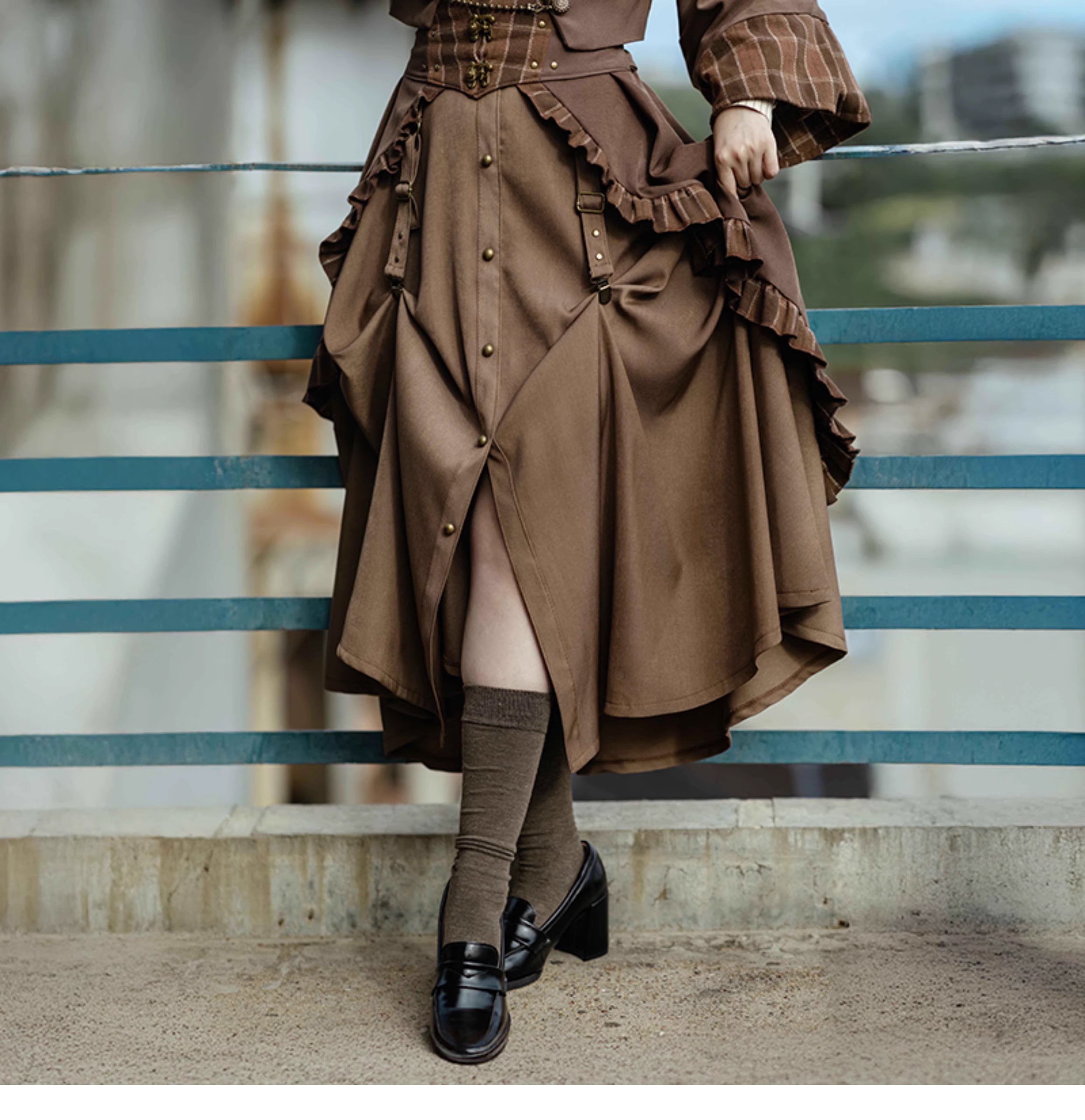 Design Concept:
This Lolita skirt in brown features a charming lace-trimmed plaid design and a flattering A-line silhouette, combining vintage elegance with playful Lolita style. The high-waist cut enhances the figure while the flowing fabric ensures comfort, making it perfect for daily wear, tea parties, or casual Lolita gatherings. Its intricate lace details and plaid pattern add a sophisticated yet whimsical touch to any outfit.