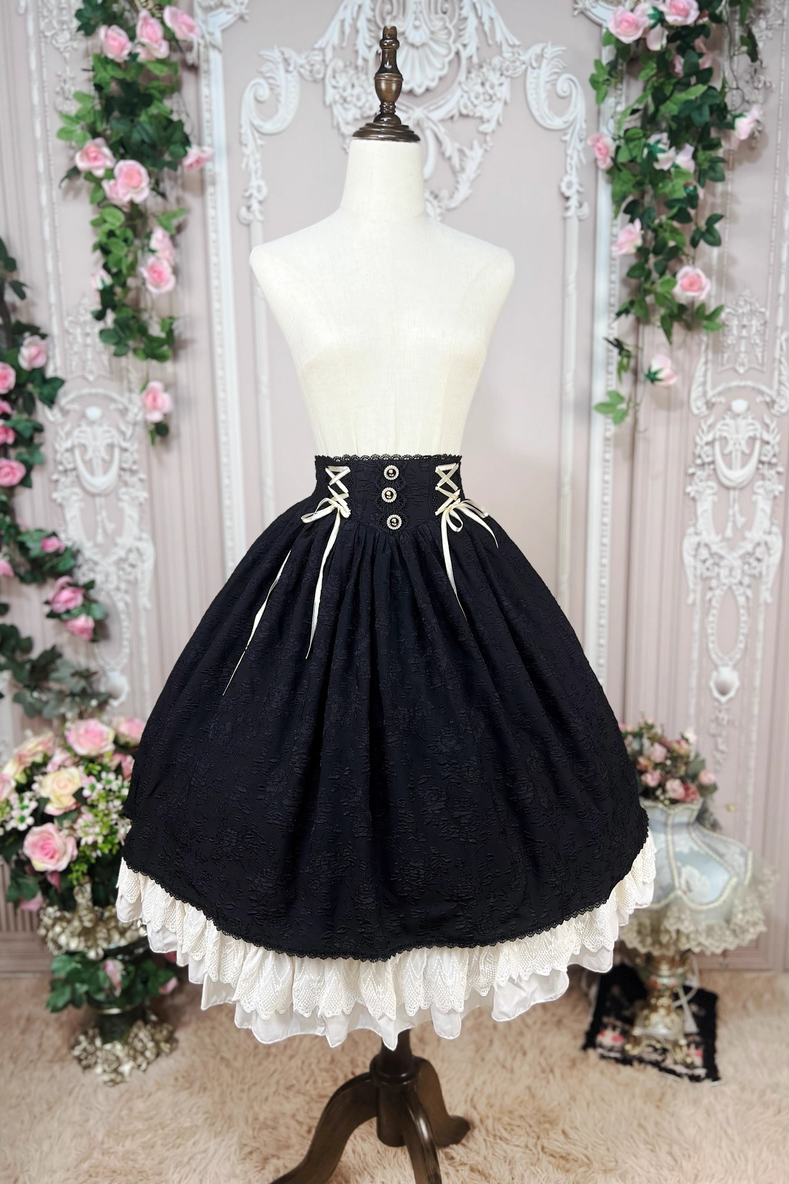 This Lolita high-waist skirt features a vintage CLA-inspired court style, combining elegance with classic Lolita charm. The structured silhouette and refined tailoring create a graceful look, perfect for layering with blouses or wearing as a statement piece. Designed in black, it adds sophistication and versatility to any Lolita wardrobe.
