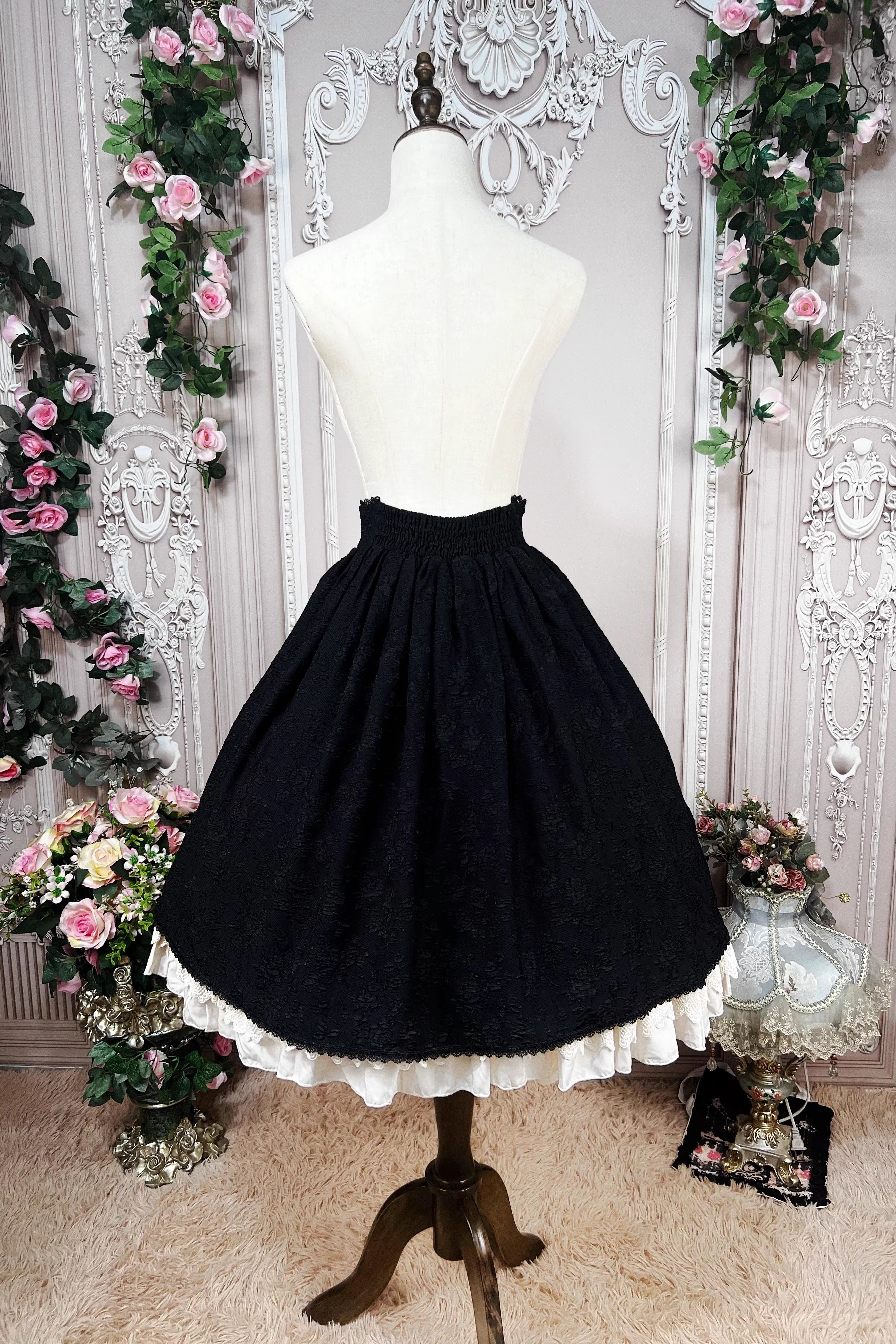 This Lolita high-waist skirt features a vintage CLA-inspired court style, combining elegance with classic Lolita charm. The structured silhouette and refined tailoring create a graceful look, perfect for layering with blouses or wearing as a statement piece. Designed in black, it adds sophistication and versatility to any Lolita wardrobe.