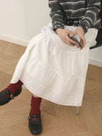 Design Concept:
This Lolita skirt in pure white is crafted from soft, breathable cotton with a comfortable elastic waistband. Designed in a versatile midi length, it offers a relaxed yet elegant silhouette that pairs effortlessly with various Lolita blouses and accessories. The simplicity of the design highlights a clean and classic charm, making it suitable for daily wear, casual outings, or layering for seasonal Lolita looks.