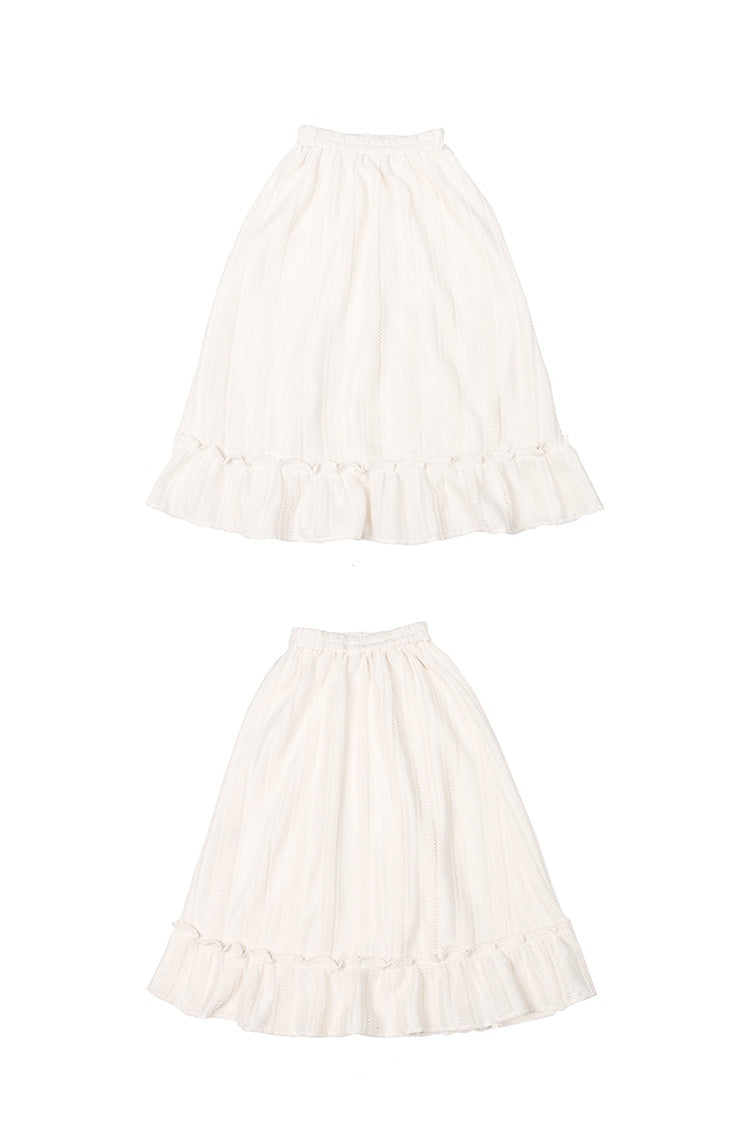 Designed for effortless elegance, this skirt combines a forgiving elastic waistband with a softly flared A-line silhouette to create a universally flattering shape. The subtle flounced hem adds a touch of movement and romance. Crafted in a warm apricot hue, this versatile piece is made to seamlessly transition from casual daytime wear to refined autumn evenings, offering both comfort and timeless style.