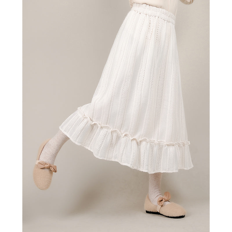 Designed for effortless elegance, this skirt combines a forgiving elastic waistband with a softly flared A-line silhouette to create a universally flattering shape. The subtle flounced hem adds a touch of movement and romance. Crafted in a warm apricot hue, this versatile piece is made to seamlessly transition from casual daytime wear to refined autumn evenings, offering both comfort and timeless style.
