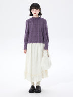 Embrace autumn’s artistry in this beige jacquard knit skirt, where texture meets timeless elegance. Delicate lace-like patterns and a subtle ruffle hem create a soft, romantic silhouette, while the elastic waist ensures effortless comfort. Crafted from premium knit fabric, this A-line midi skirt offers warmth without weight, perfect for transitional weather. Ideal for pairing with cozy sweaters or refined blouses, it blends rustic charm with sophisticated detail. Whether for café dates or evening strolls, t