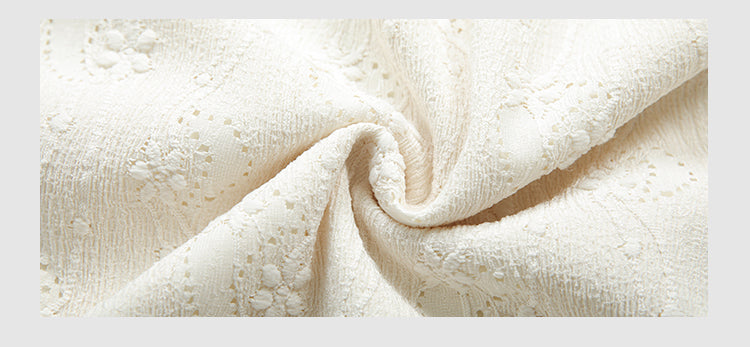 Embrace autumn’s artistry in this beige jacquard knit skirt, where texture meets timeless elegance. Delicate lace-like patterns and a subtle ruffle hem create a soft, romantic silhouette, while the elastic waist ensures effortless comfort. Crafted from premium knit fabric, this A-line midi skirt offers warmth without weight, perfect for transitional weather. Ideal for pairing with cozy sweaters or refined blouses, it blends rustic charm with sophisticated detail. Whether for café dates or evening strolls, t