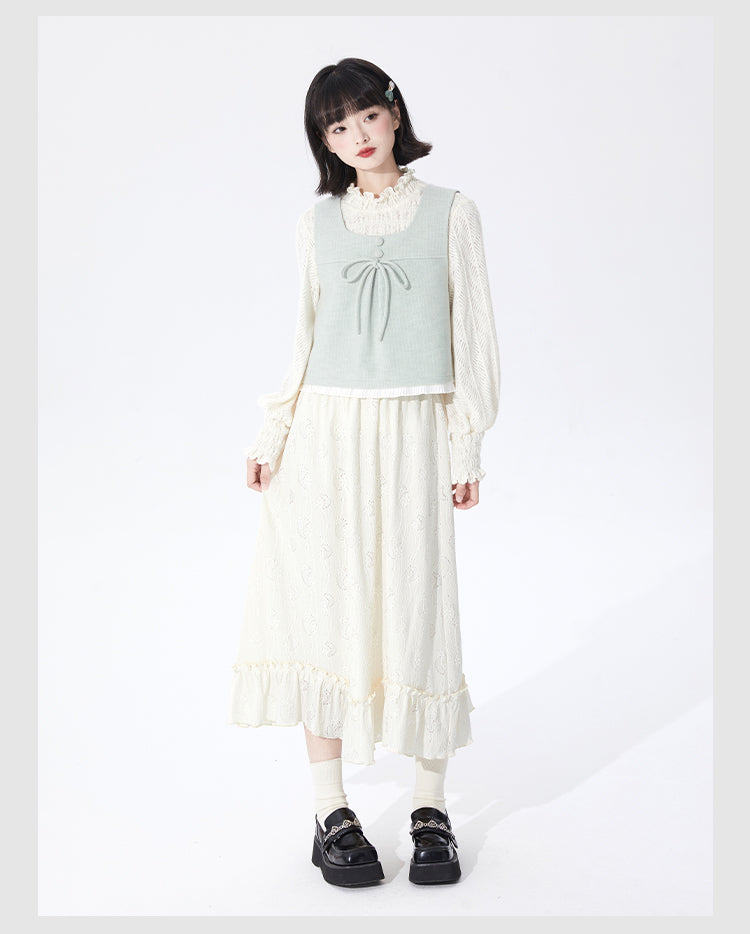 Embrace autumn’s artistry in this beige jacquard knit skirt, where texture meets timeless elegance. Delicate lace-like patterns and a subtle ruffle hem create a soft, romantic silhouette, while the elastic waist ensures effortless comfort. Crafted from premium knit fabric, this A-line midi skirt offers warmth without weight, perfect for transitional weather. Ideal for pairing with cozy sweaters or refined blouses, it blends rustic charm with sophisticated detail. Whether for café dates or evening strolls, t