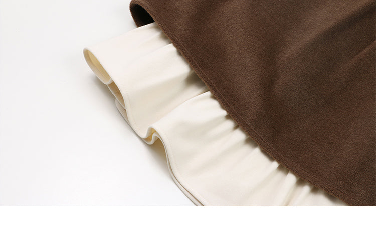 This skirt blends vintage charm with modern elegance. The high-waisted A-line silhouette and delicate pleats gracefully conceal hips and elongate the figure. A soft flounce hem adds a touch of romantic movement. Crafted from warm wool blend fabric, it's designed for both comfort and style, offering a timeless piece that transitions seamlessly from casual daytime outings to refined autumn evenings.