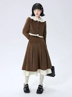 This skirt blends vintage charm with modern elegance. The high-waisted A-line silhouette and delicate pleats gracefully conceal hips and elongate the figure. A soft flounce hem adds a touch of romantic movement. Crafted from warm wool blend fabric, it's designed for both comfort and style, offering a timeless piece that transitions seamlessly from casual daytime outings to refined autumn evenings.