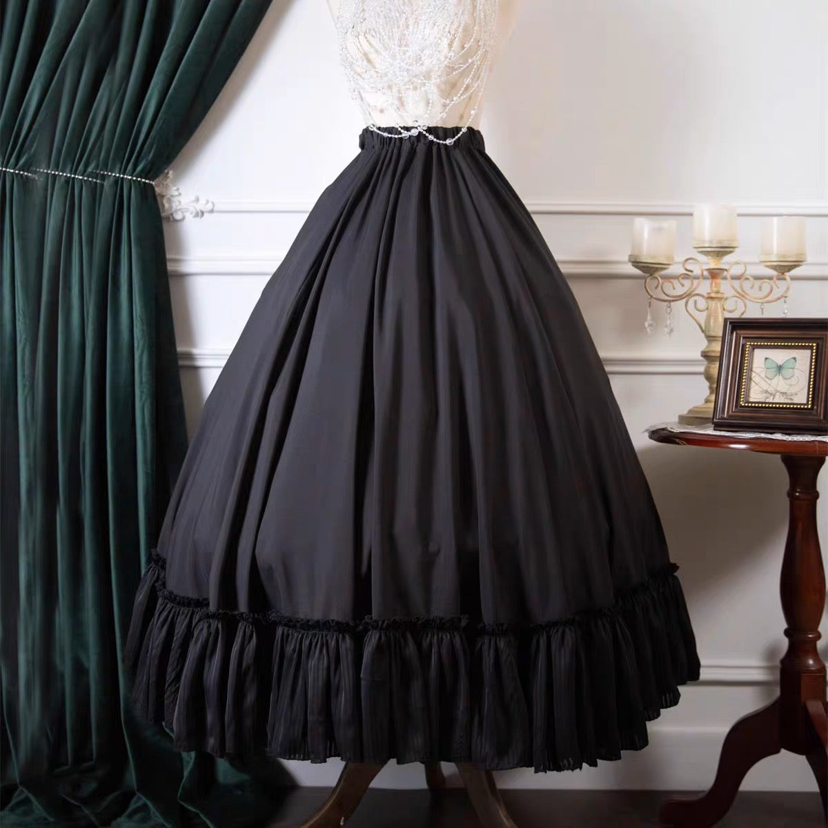 Embrace timeless elegance with this classic Lolita A-line skirt. Crafted for versatility, its high-waist design and graceful silhouette flatter every figure. The monochromatic black and white scheme pairs seamlessly with any Lolita blouse or accessory. Made from premium structured fabric, it maintains its shape while offering comfort for all-day wear. Perfect for tea parties, conventions, or elegant daily wear, this skirt embodies the refined spirit of traditional Lolita fashion—where sophistication meets w