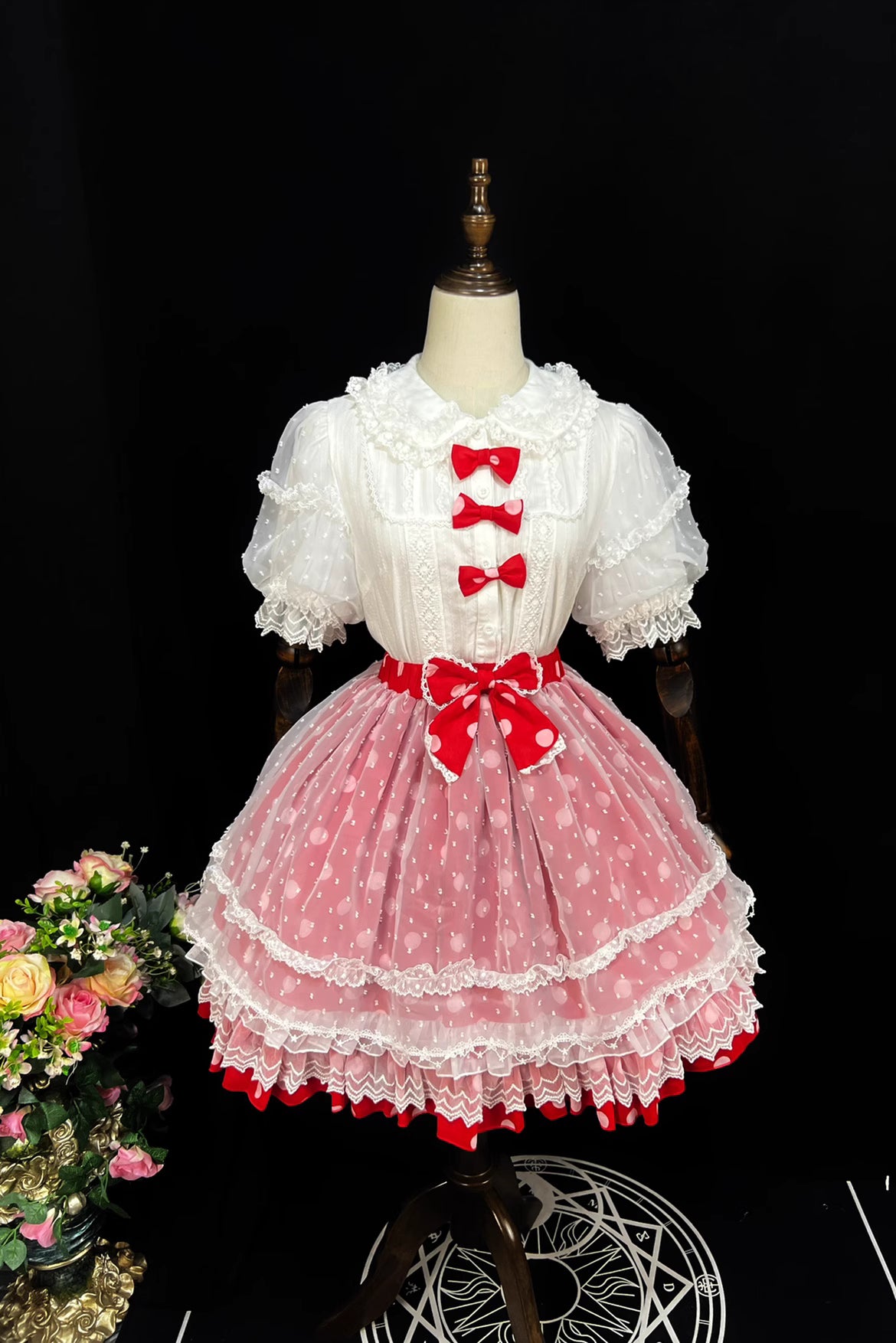 This sweet Lolita skirt combines vibrant red, green and orange hues in a playful summer design. The elastic waist ensures comfortable flexibility while layered chiffon and mesh create dynamic texture. Delicate bow accents add classic Lolita charm to this short skirt silhouette. Perfect for creating sweet or classic coordinates, this lightweight skirt offers effortless movement and timeless elegance. The cheerful color palette makes it ideal for seasonal celebrations and everyday fantasy wear.